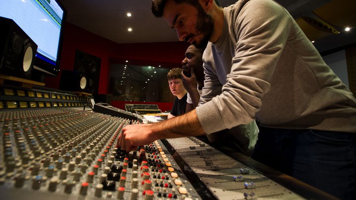 Student using a recording studio